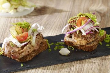 Grilled Pork Neck with Horseradish, Cranberries, and Salad