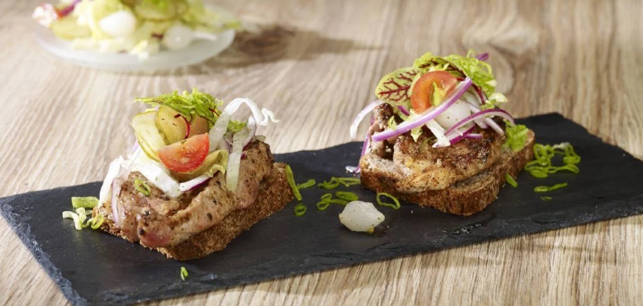 Grilled Pork Neck with Horseradish, Cranberries, and Salad